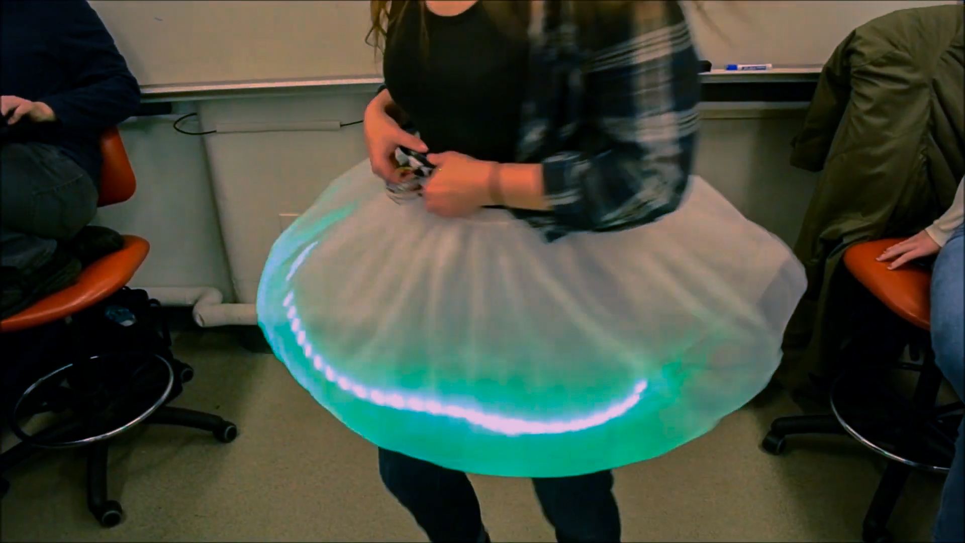 Whirling skirt with LED strip shines green